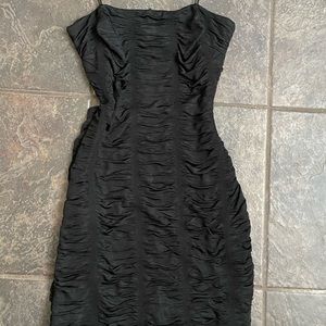 thin strapped black dress with open back, fabric is super flattering